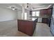 Kitchen with granite island and dark wood cabinetry at 8214 E Mcdonald Dr, Scottsdale, AZ 85250