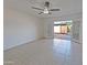 Living room with tile flooring and access to backyard at 8214 E Mcdonald Dr, Scottsdale, AZ 85250