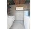 Small laundry area with washer, dryer, and cabinets at 8214 E Mcdonald Dr, Scottsdale, AZ 85250