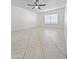 Bright living room featuring tile floors and a ceiling fan at 8214 E Mcdonald Dr, Scottsdale, AZ 85250