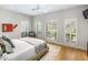 Bright bedroom with plantation shutters and wood flooring at 8836 N 47Th Pl, Phoenix, AZ 85028