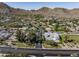 Aerial view of a luxury home with mountain views, situated near a major road at 8836 N 47Th Pl, Phoenix, AZ 85028