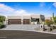 Two-car garage with desert landscaping at 18714 E Ironwood Cir, Rio Verde, AZ 85263