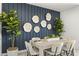 Elegant dining area with a stylish table, chairs, and an accent wall at 5175 E Midnight Star Dr, San Tan Valley, AZ 85143