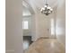 Elegant entryway with chandelier, hardwood floors, and arched doorways at 3076 E La Costa Dr, Gilbert, AZ 85298