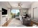 Living area with sectional sofa and sliding glass doors leading to the patio at 6745 N 93Rd Ave # 1133, Glendale, AZ 85305