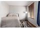 Cozy bedroom with a double bed and a floor lamp at 6745 N 93Rd Ave # 1133, Glendale, AZ 85305
