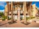 Westgate community building exterior with palm trees and signage at 6745 N 93Rd Ave # 1133, Glendale, AZ 85305