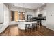 Modern kitchen featuring an island, stainless steel appliances, and hardwood floors at 6745 N 93Rd Ave # 1133, Glendale, AZ 85305
