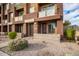 Townhouse exterior with private entrance and landscaping at 6745 N 93Rd Ave # 1133, Glendale, AZ 85305