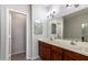 Double vanity bathroom with updated fixtures and a spacious layout at 6745 N 93Rd Ave # 1133, Glendale, AZ 85305