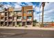 Townhouse building exterior with street view and landscaping at 6745 N 93Rd Ave # 1133, Glendale, AZ 85305