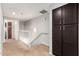 Upstairs hallway with dark brown storage cabinets at 6745 N 93Rd Ave # 1133, Glendale, AZ 85305