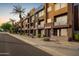 Modern building exterior with multiple units and street view at 6745 N 93Rd Ave # 1133, Glendale, AZ 85305