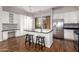 Updated kitchen with white cabinets, granite counters, and stainless steel appliances at 6745 N 93Rd Ave # 1133, Glendale, AZ 85305
