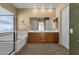 Bathroom with double sinks, a large mirror, and a walk-in shower at 3113 E Boston St, Gilbert, AZ 85295