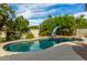 Inviting kidney-shaped pool with a slide and diving board at 10338 E San Salvador Dr, Scottsdale, AZ 85258