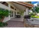 Covered patio with outdoor kitchen and table at 10338 E San Salvador Dr, Scottsdale, AZ 85258