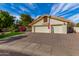 House exterior showcasing a two-car garage and a neatly paved driveway at 10338 E San Salvador Dr, Scottsdale, AZ 85258