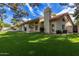 House exterior with covered patio and lush lawn at 10338 E San Salvador Dr, Scottsdale, AZ 85258