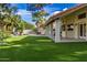 Landscaped backyard with a covered patio and pool at 10338 E San Salvador Dr, Scottsdale, AZ 85258