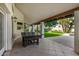 Spacious covered patio with table tennis table and backyard view at 10338 E San Salvador Dr, Scottsdale, AZ 85258