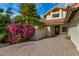 Front entry with decorative tile and flowering bushes at 10338 E San Salvador Dr, Scottsdale, AZ 85258