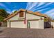 Two-car garage with off-white doors and paver driveway at 10338 E San Salvador Dr, Scottsdale, AZ 85258