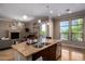 Kitchen island with granite countertop, double sink and seating at 7297 N Scottsdale Rd # 1004, Paradise Valley, AZ 85253