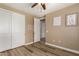 Well-lit bedroom with hardwood floors and double closets at 7297 N Scottsdale Rd # 1004, Paradise Valley, AZ 85253