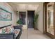 Front entry featuring a dark wood door and a sitting area at 7297 N Scottsdale Rd # 1004, Paradise Valley, AZ 85253