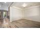 Spacious living room featuring hardwood floors and access to other rooms at 7297 N Scottsdale Rd # 1004, Paradise Valley, AZ 85253