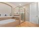 Modern bathroom with a walk-in shower and a soaking tub at 7297 N Scottsdale Rd # 1004, Paradise Valley, AZ 85253