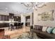 Living room features a fireplace, chandelier, and comfortable seating at 7297 N Scottsdale Rd # 1004, Paradise Valley, AZ 85253