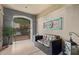Inviting front porch with seating area and decorative wall art at 7297 N Scottsdale Rd # 1004, Paradise Valley, AZ 85253