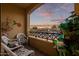 Private balcony with seating and scenic sunset views at 7297 N Scottsdale Rd # 1004, Paradise Valley, AZ 85253