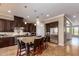 Gourmet kitchen with granite island, stainless steel appliances, and dark wood cabinetry at 7297 N Scottsdale Rd # 1004, Paradise Valley, AZ 85253