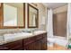 Elegant bathroom with double sinks and a shower/tub combo at 7297 N Scottsdale Rd # 1004, Paradise Valley, AZ 85253