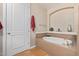Relaxing bathroom with a large soaking tub and tile flooring at 7297 N Scottsdale Rd # 1004, Paradise Valley, AZ 85253