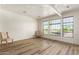 Bright living room with hardwood floors and large windows at 7297 N Scottsdale Rd # 1004, Paradise Valley, AZ 85253