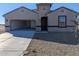 New construction home with a two-car garage and desert landscaping at 18765 E Bruno Dr, Gold Canyon, AZ 85118