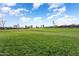 Expansive view of a manicured golf course on a beautiful day at 2606 N 159Th Dr, Goodyear, AZ 85395