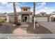 Beautiful two-story home with brick and stone exterior and landscaping at 2606 N 159Th Dr, Goodyear, AZ 85395