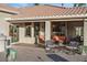 Covered patio with comfortable seating and built-in grill at 2606 N 159Th Dr, Goodyear, AZ 85395