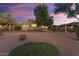 House exterior with desert landscaping at sunset at 2606 N 159Th Dr, Goodyear, AZ 85395