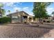 House exterior with desert landscaping and golf course views at 2606 N 159Th Dr, Goodyear, AZ 85395