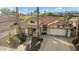 Aerial view of a beautiful home with a large driveway and landscaping at 2606 N 159Th Dr, Goodyear, AZ 85395
