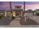 Two-story home with attractive landscaping and a large driveway at 2606 N 159Th Dr, Goodyear, AZ 85395