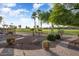Landscaped yard with a brick walkway and golf course views at 2606 N 159Th Dr, Goodyear, AZ 85395