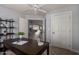 Home office with a large desk, shelving, and view to living area at 2222 S Yellow Wood --, Mesa, AZ 85209